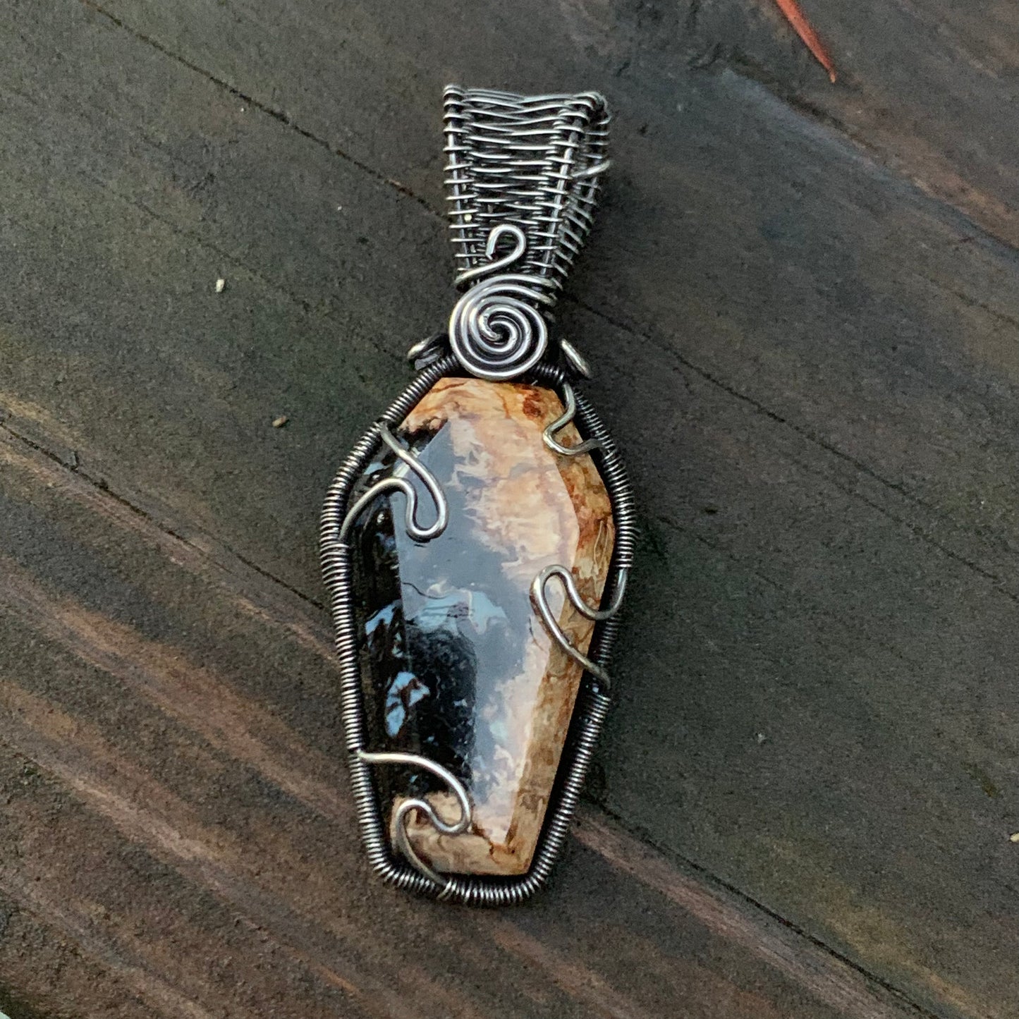 The Coffin Of Rest And Peace featuring a Beautiful Carved Petrified Palm Root Coffin Wire Wrapped in Antiqued and polished Sterling Silver