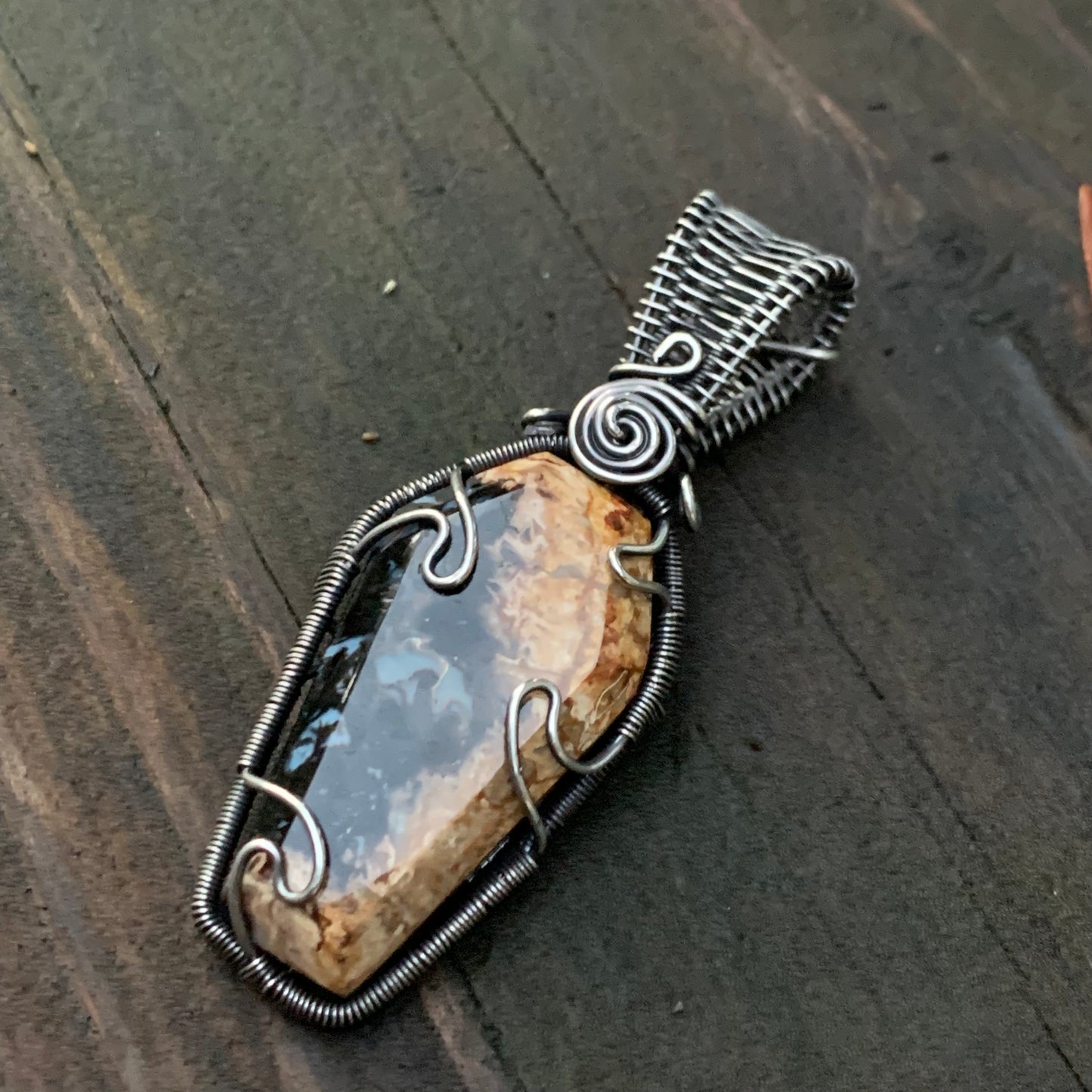 The Coffin Of Rest And Peace featuring a Beautiful Carved Petrified Palm Root Coffin Wire Wrapped in Antiqued and polished Sterling Silver