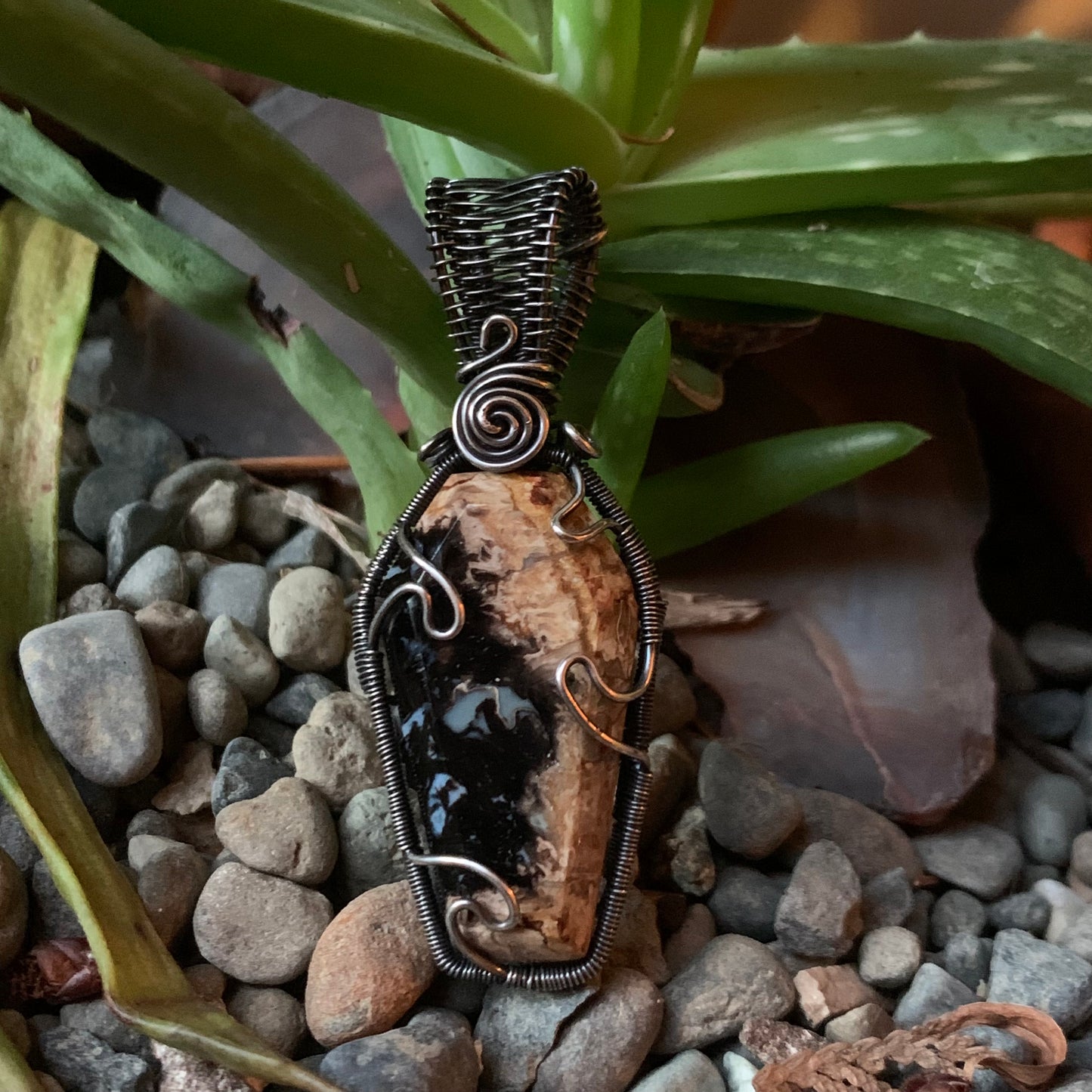 The Coffin Of Rest And Peace featuring a Beautiful Carved Petrified Palm Root Coffin Wire Wrapped in Antiqued and polished Sterling Silver