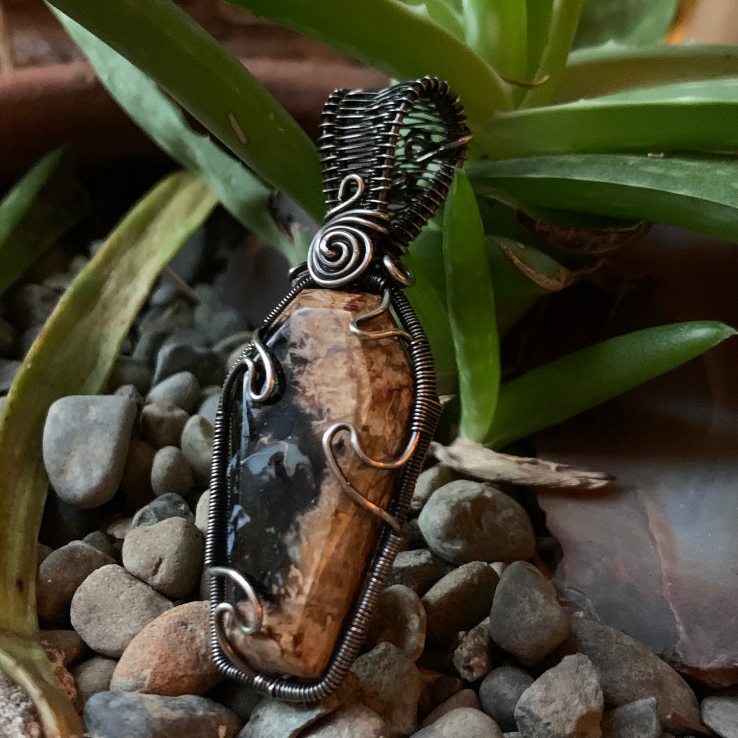 The Coffin Of Rest And Peace featuring a Beautiful Carved Petrified Palm Root Coffin Wire Wrapped in Antiqued and polished Sterling Silver